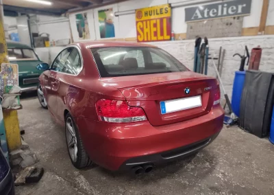 BMW 135i Coupe E82 rouge dans l’atelier Autorosati